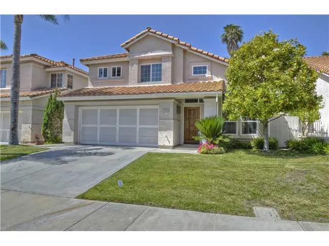 This home is nicely situated on a large lot on the quiet side of the street with no neighbor behind you! Beautiful landscaping!