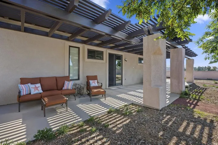 Beautiful sitting area in the back. Overlooks a huge yard with potential to add a pool easily.