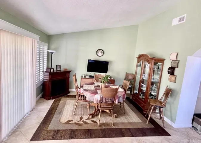 Dining area off kitchen. Slider leads to rear patio/yard.