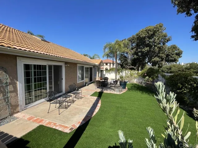 Easy care artificial turf in rear yard.