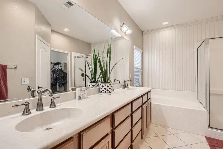 Large Master bath with dual sinks, separate tub and shower.