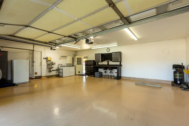 3 car garage with wash sink and attic storage