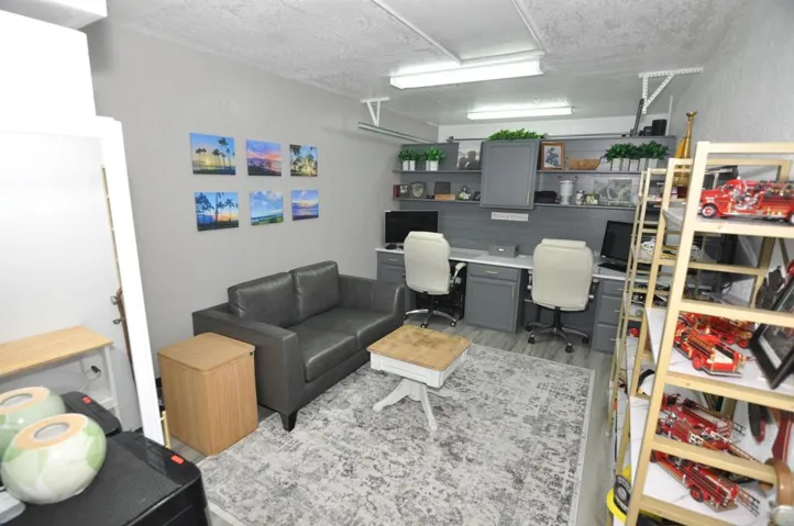 Office has a temporary Wall.  This is a portion of the One car Garage