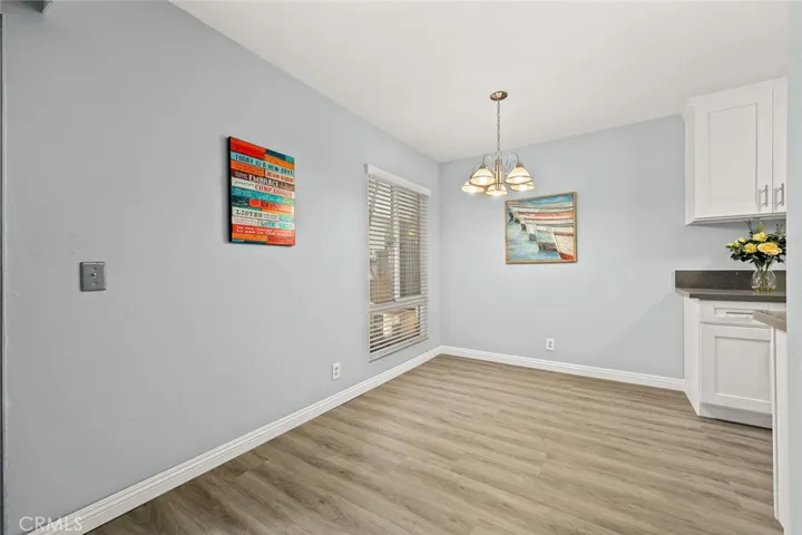 Double pane vinyl windows, new window blinds, fresh custom two-tone paint, and new vinyl floor.