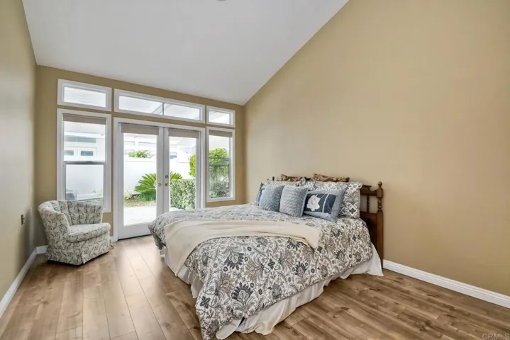 Large Master bedroom with doors to patio. Measures 17 x 11.