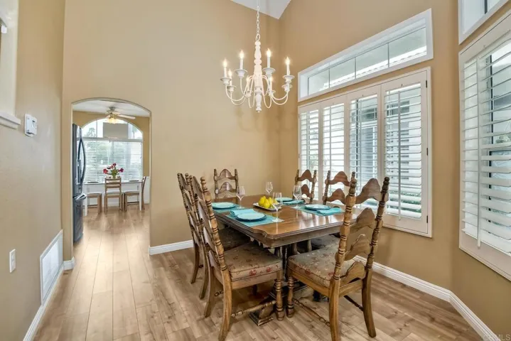 Formal Dining Room with plantation shutters. Measures 10 x 10.
