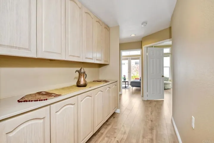 Hall way to the main floor bedrooms. Large storage area.