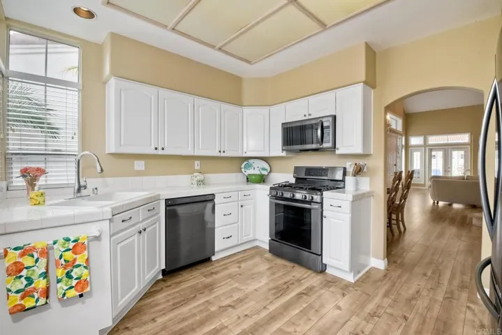 Kitchen with stove, microwave, and dishwasher.