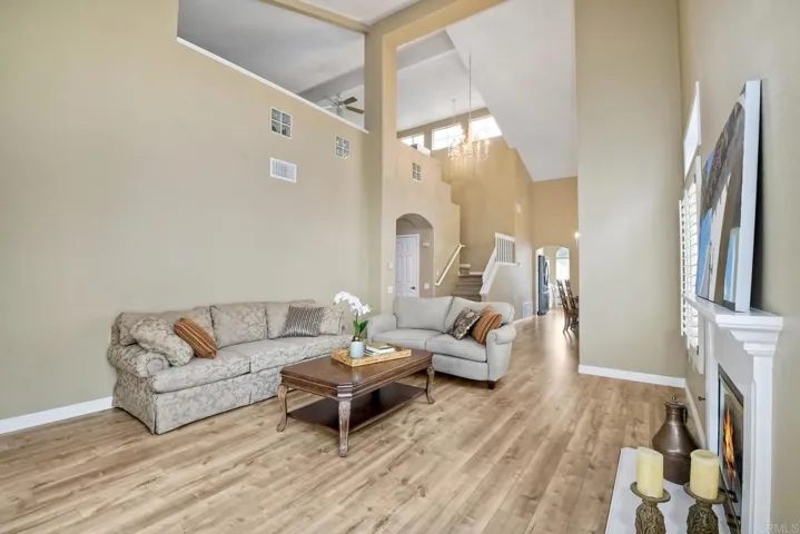 Living room toward the kitchen. Also the staircase up to the loft area.