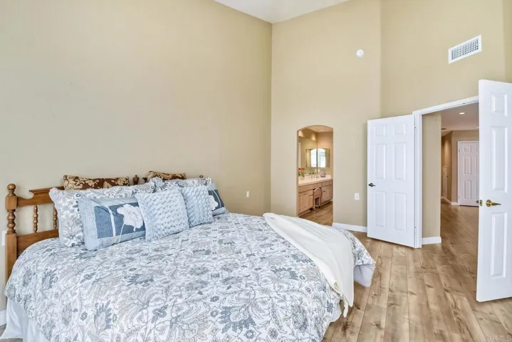 Shows double door entry and entry to Master Bathroom Suite.