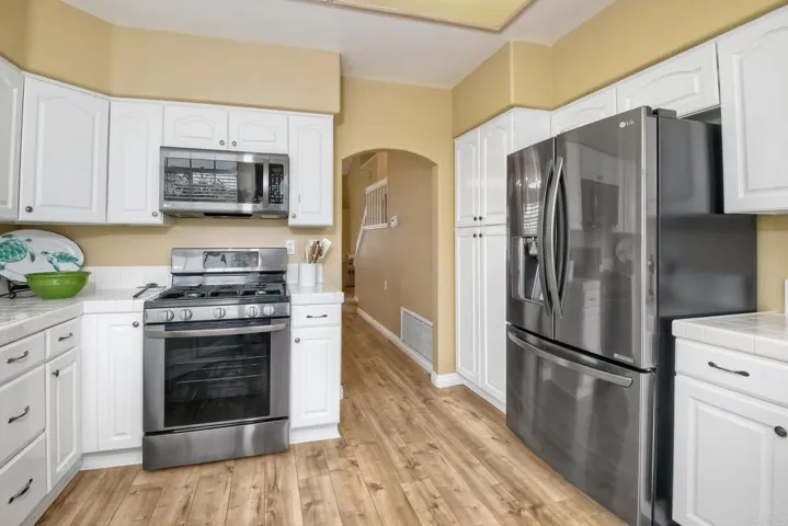 Kitchen with lots of counter space and refrigerator.