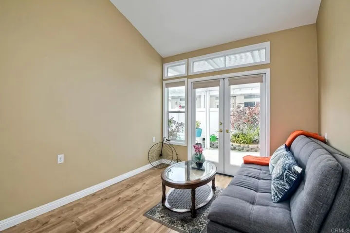 Secondary bedroom on the main floor. Doors to patio. Measures 10 x 10