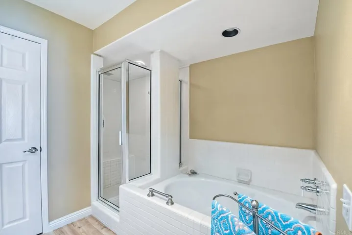 Master Bathroom with large walk in shower and soaking tub.