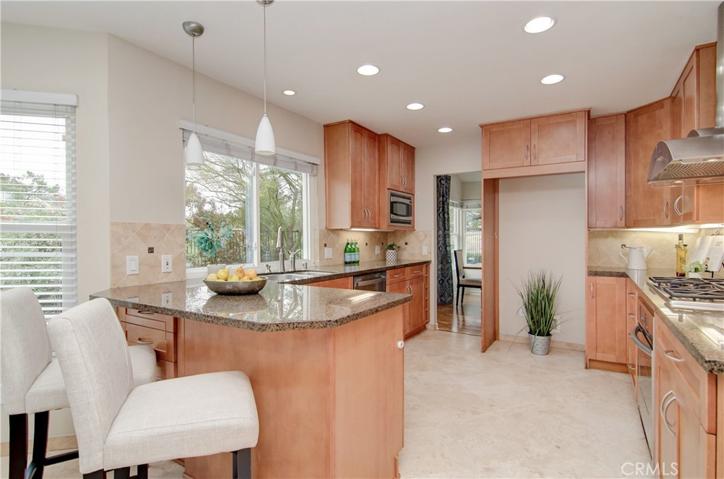All chefs welcome! So much prep and storage space here...plus a window at the sink lets you enjoy this special setting.  "Helpers" can enjoy the action from the breakfast bar.