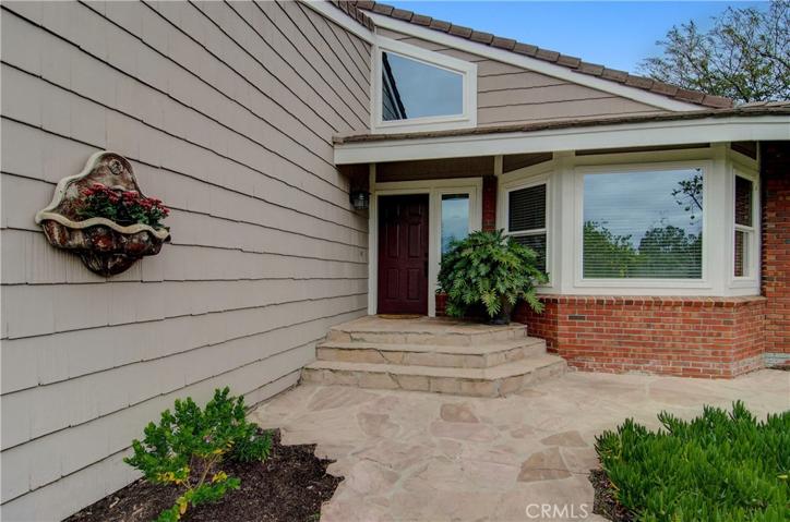 Sunny, southern exposure plus natural stone steps and porch are a great place to greet guests.