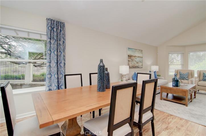 Formal dining space enjoys garden and open space views from every angle...this flexible room works for any size gathering.