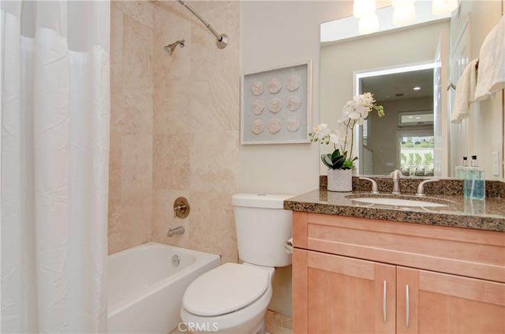 Downstairs full bath is nicely remodeled and has additional door to downstairs bedroom.