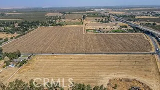 Full photo of 41 acs. Looking East. Top parcel. Santa Fe and Hwy 140 to right.