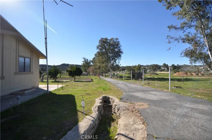Secondary Driveway that runs length of property
