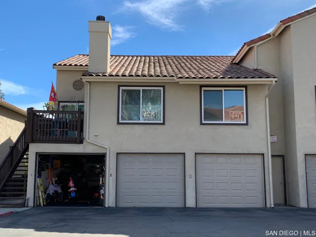 Single car garage located where the garage door is open