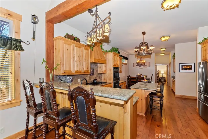 Kitchen with Breakfast Bar and Granite Top