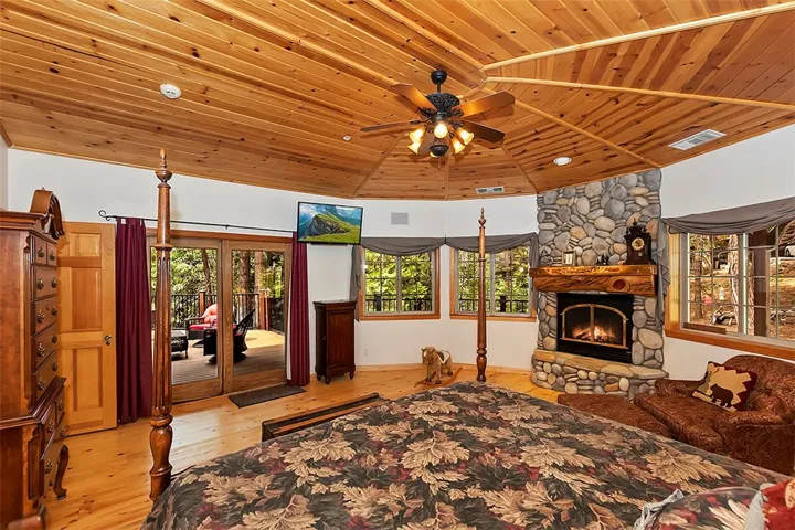 Master Bedroom
Pine Ceiling and Pine floor.
Custom Carved wood Mantel with Heat and Glow Gas Fireplace Insert.