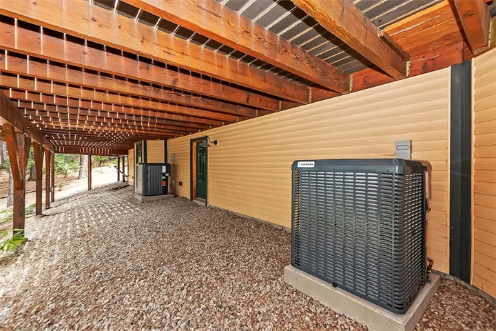 Under Trex Deck
2 Air Conditioning Units with Large Storage build-up.
