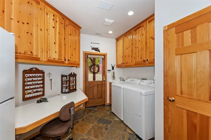 Laundry Room
Washer/Dryer area with Sink. Sewing Table. Enclosed fold down ironing board.