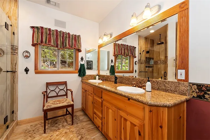 Master Bathroom
His and Her Sinks w/ Granite Countertops. Updated Tile Floors w/ Heat/Temperature Control.