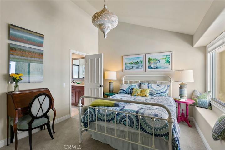 Secondary guest/kids rooms share Jack and Jill bath and have large, mirrored wardrobe closets.