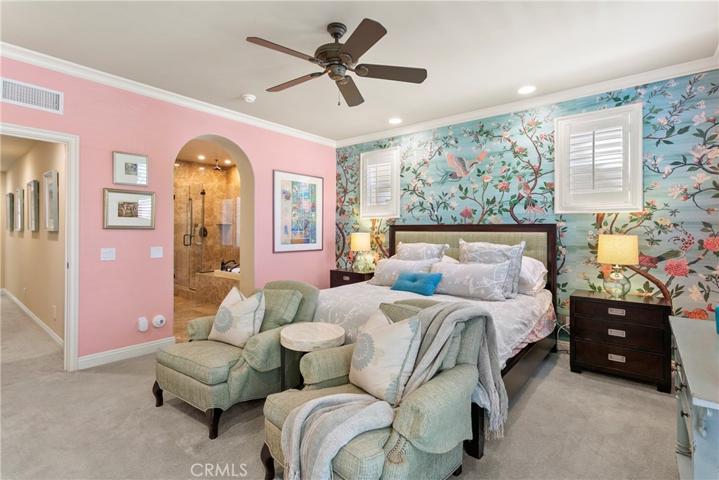 Master suite is in its own wing and has large bedroom with fireplace and balcony.