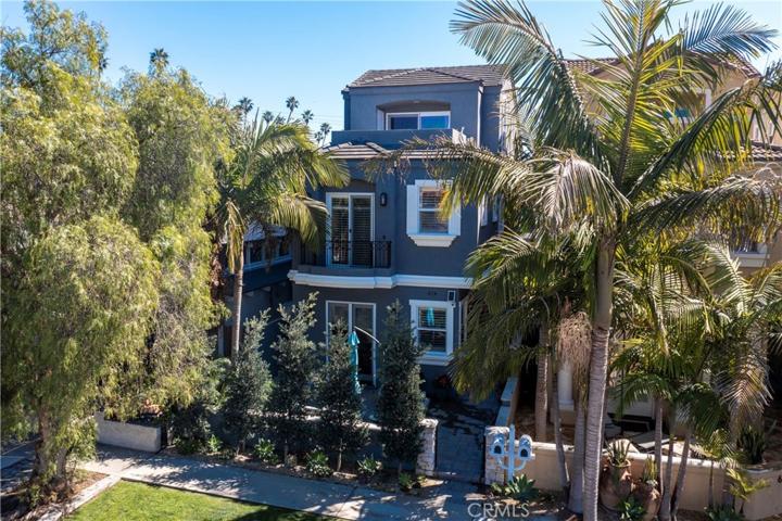 Classic style with contemporary tones is framed by mature trees and privacy hedge that sets the stage for this three story Downtown master piece.