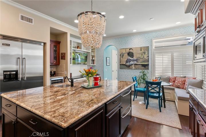 Sooooo many great features here that will please everyone...Professional Viking appliances, double beverage drawers, separate bar area with wine fridge, walk-in pantry, island prep sink, pot filler...you get the picture!