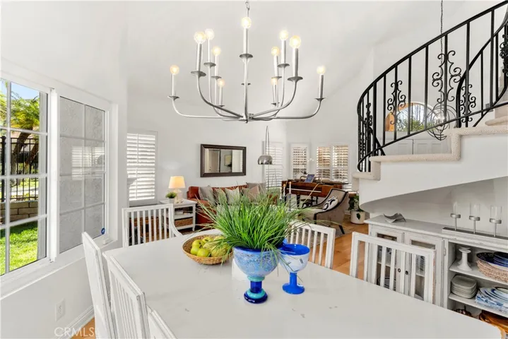 Dining Area with newer chandelier. This home is so open and light and bright.