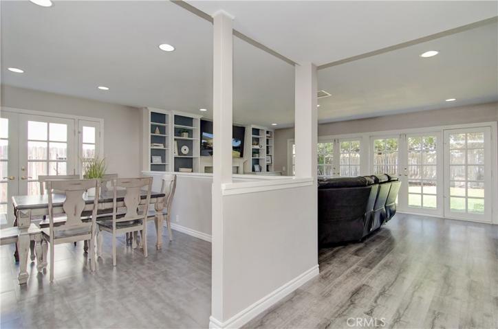 Open layout with half wall offers open feel plus allows for more furniture options.