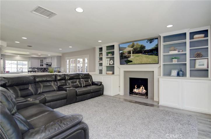 Nothing more needed...fireplace, game storage, big flat screen and plenty of seating for the big game...or family movie night.