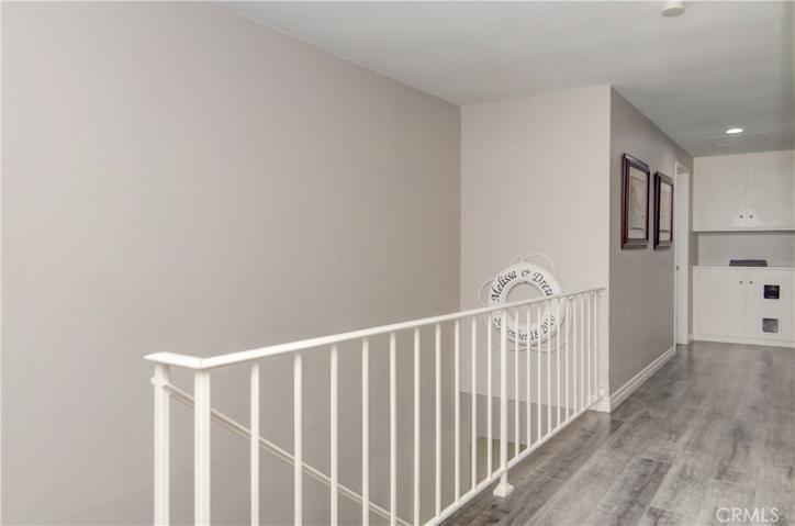 Upstairs layout is great...vinyl planks continue in the hallway.