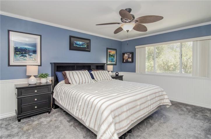 Main bedroom has nice details with classic wainscoting and crown molding.