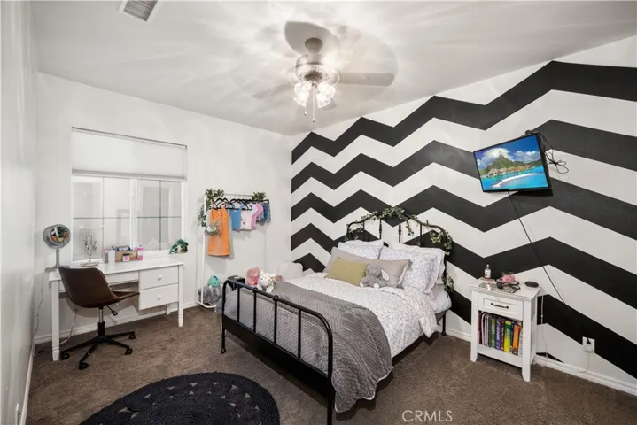 Custom paint rooms are amazing! Ceiling fan and dual paned windows with plantation shutters.