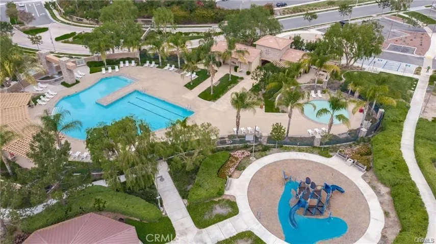 This dron shot allows you to see the pool and  park right accross the street!