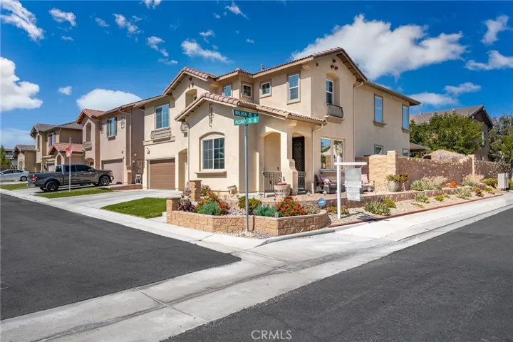 You are on the corner of Pilsner and Walden with an easy to mainttain front yard! Colorful and stunning! Your wrap around porch area makes for a great spot to enjoy a morning cup of coffeel
