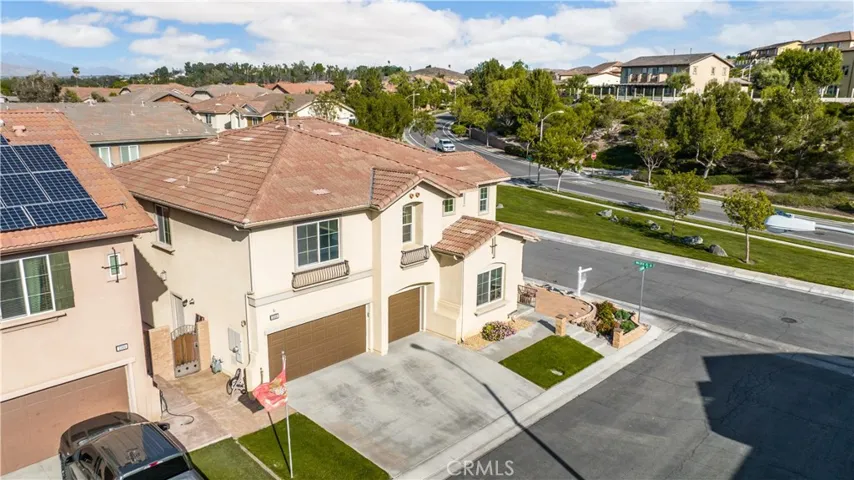 Corner lot with 3 car remote controlled garage. ATankless water heater inside the garage.