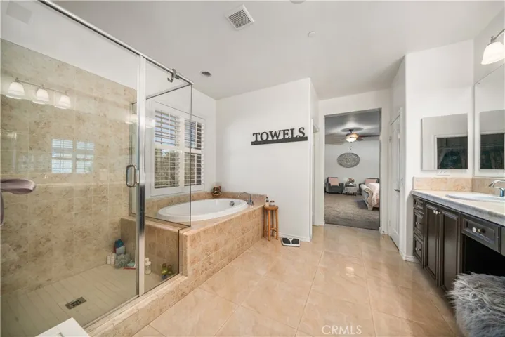 Primary en-suite has walk in shower, soaking tub, dual sinks with vanity area in the misddle! Your oversized walk-in closet is here also.