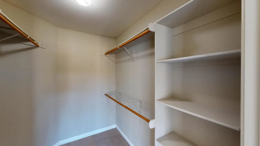 Primary bedroom closet 1 of 2