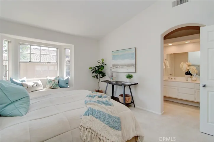 Main owner's suite is the perfect place to start and end your day...vaulted ceiling and cozy bay window add great touches.