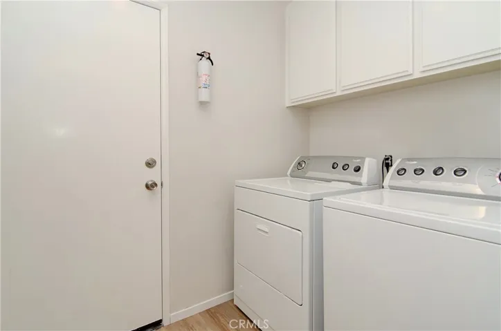 Inside laundry room connects the kitchen, powder room and garage...plus provides added storage...what could be more convenient????
