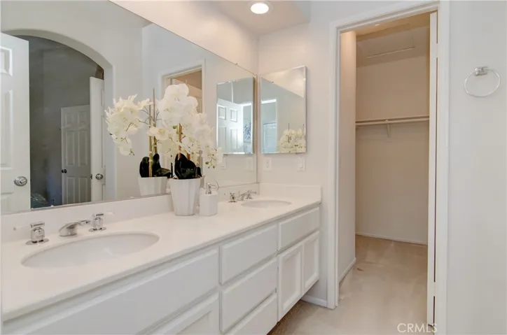Handy walk-in closet makes morning routines easy breezy...