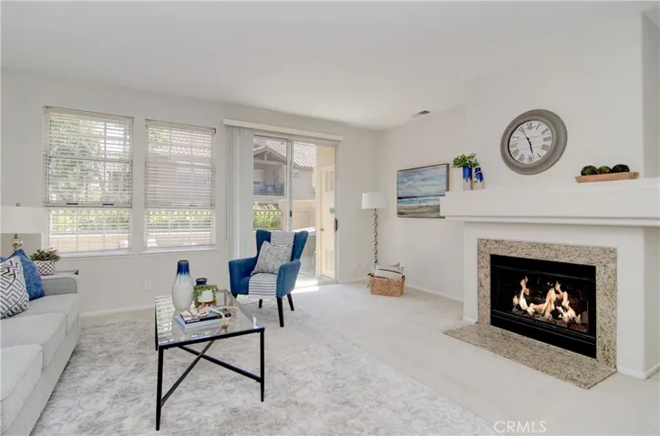 Fireplace can be enjoyed from every corner...slider to rear terrace offers EZ flow outdoors.