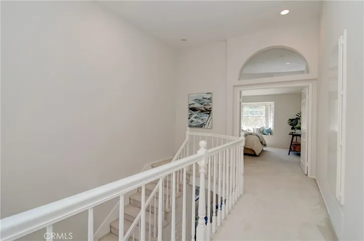 Upper gallery creates a nice separation between the two bedroom suites...plus adds space for shelving, artwork or desk space.
