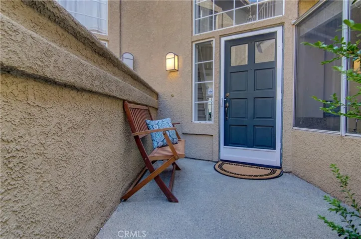 Enjoy this private, gated entry courtyard...whether coming or going...this is great for a "shoes off" household!